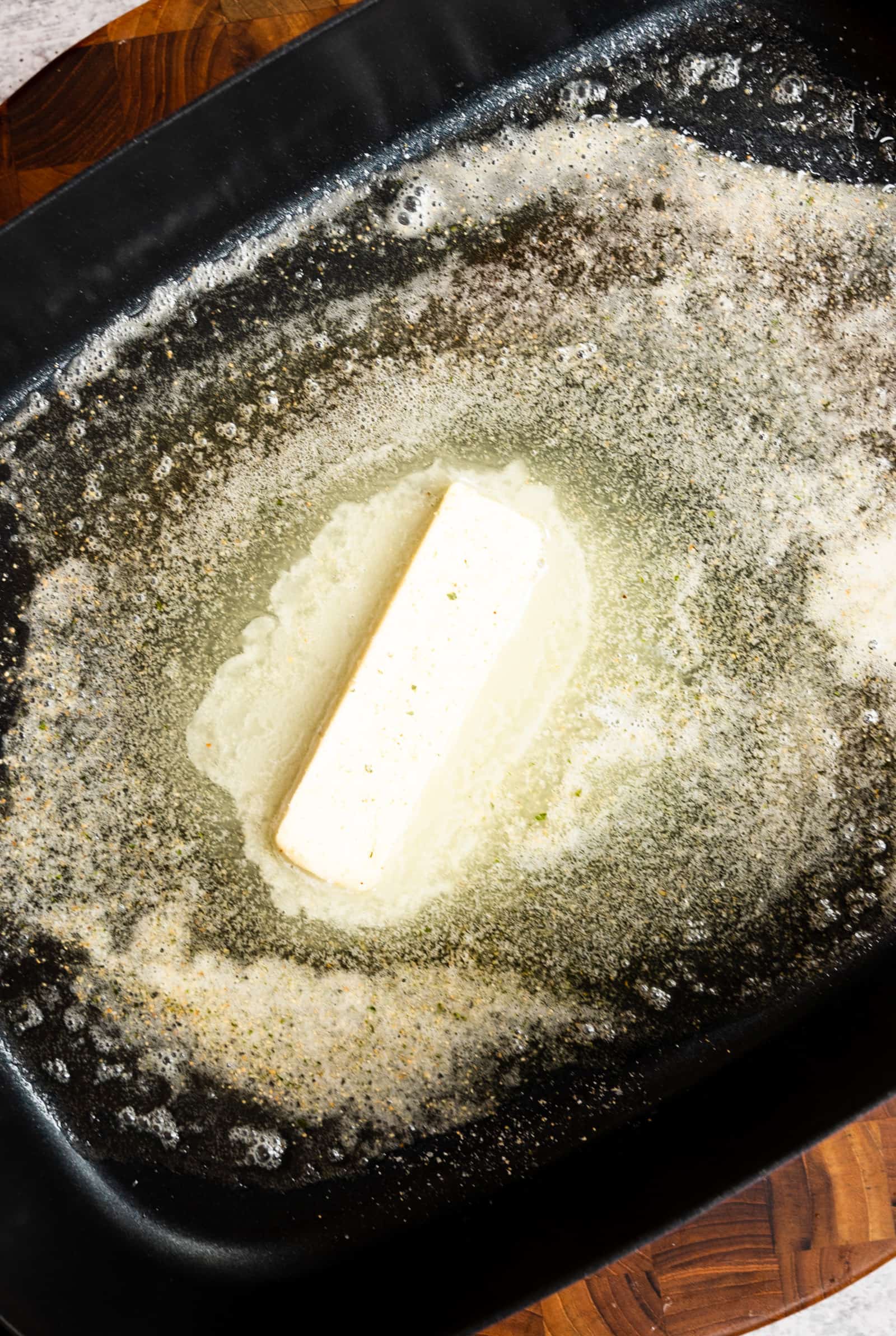 melted butter and garlic salt in an electric skillet.