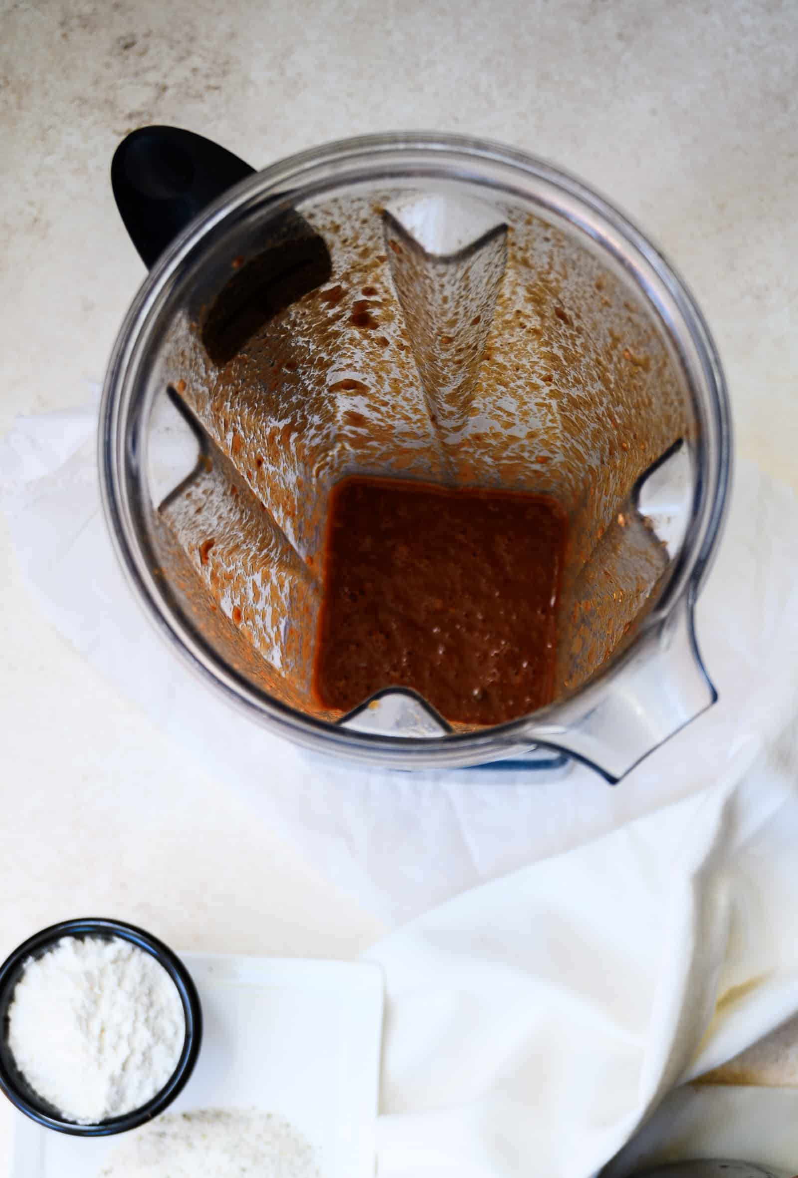 blender with adobo sauce and bowl of flour.