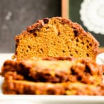 head on close up of cut loaf of pumpkin bread.