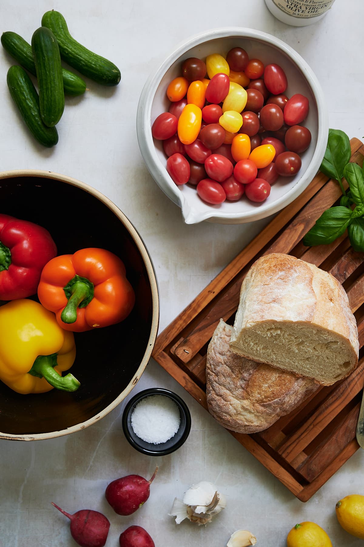 loaf of bread and vegetables for a panzanella salad