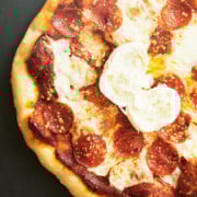 Ball of burrata in center of Vodka Sauce Pizza