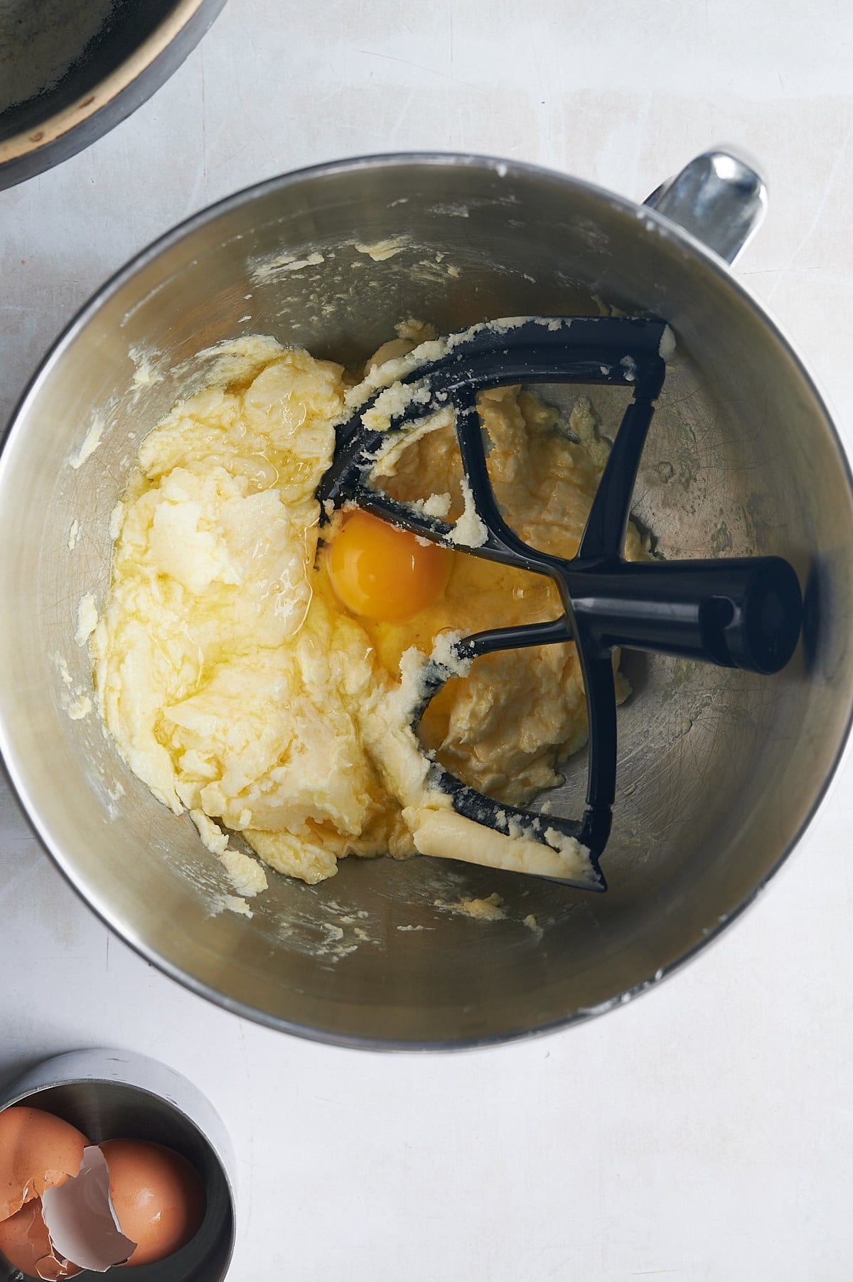 eggs being added to lemon knot butter and sugar.