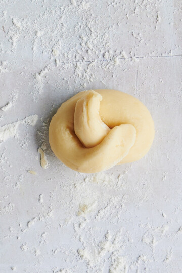 rolled dough into a lemon knot on floured countertop.