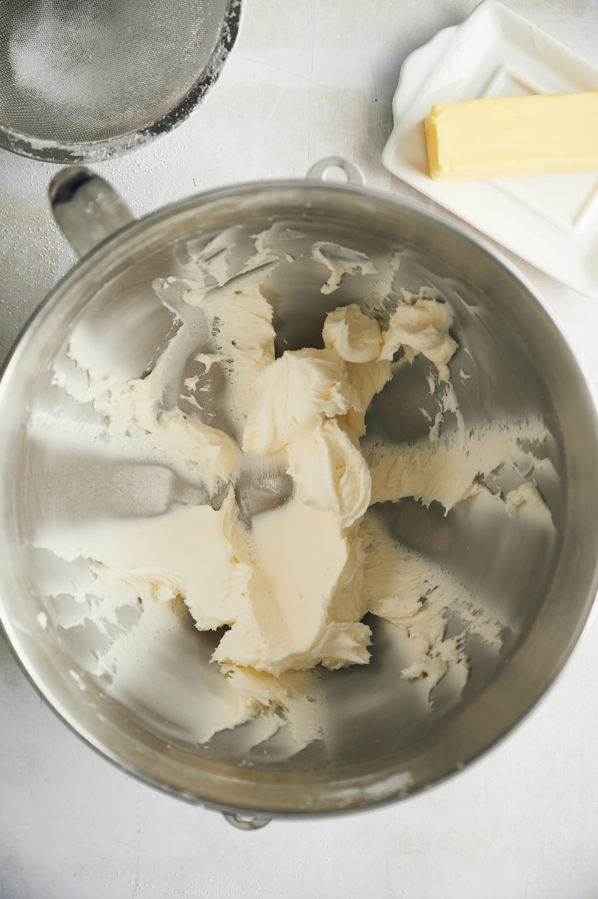 confectioners sugar and butter in mixing bowl.