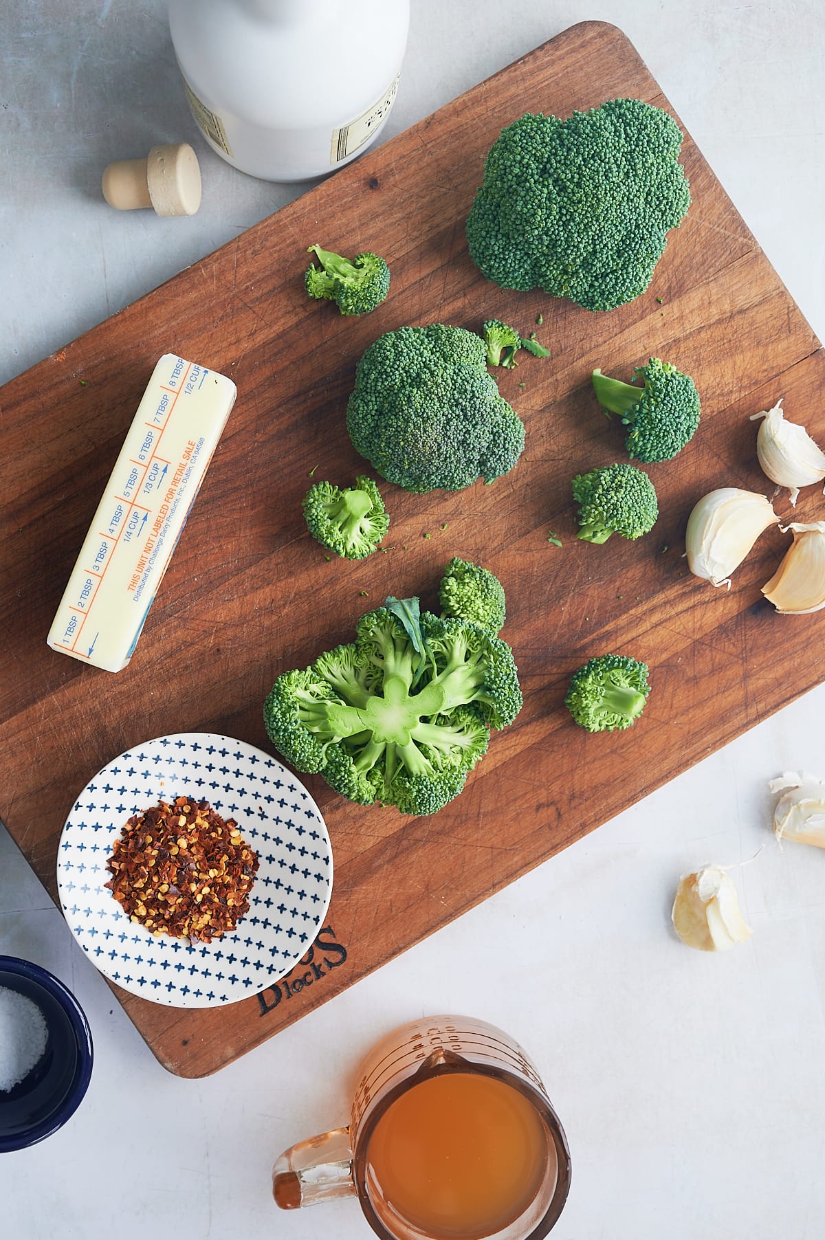 ingredients for cavatelli and broccoli on wooden board.