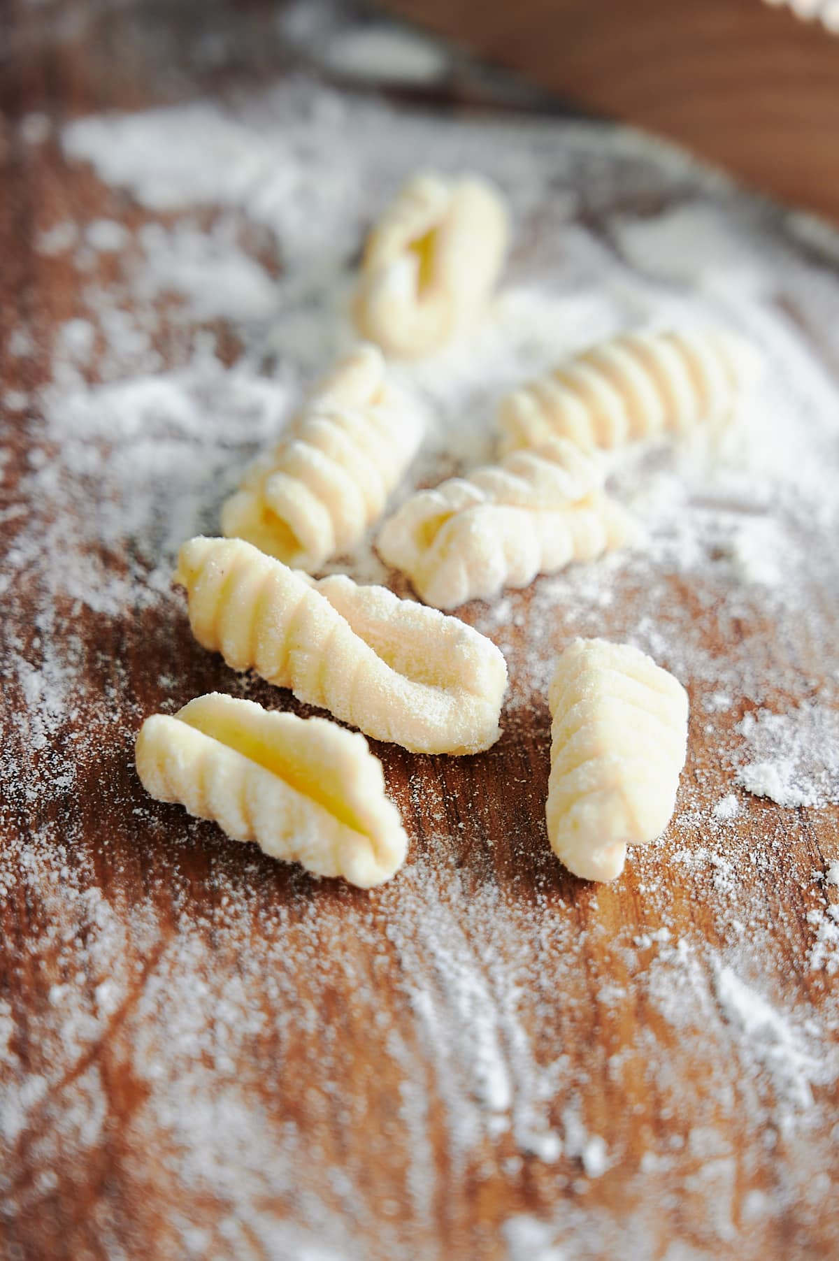 close up of handmade cavatelli pasta on flour dusted board