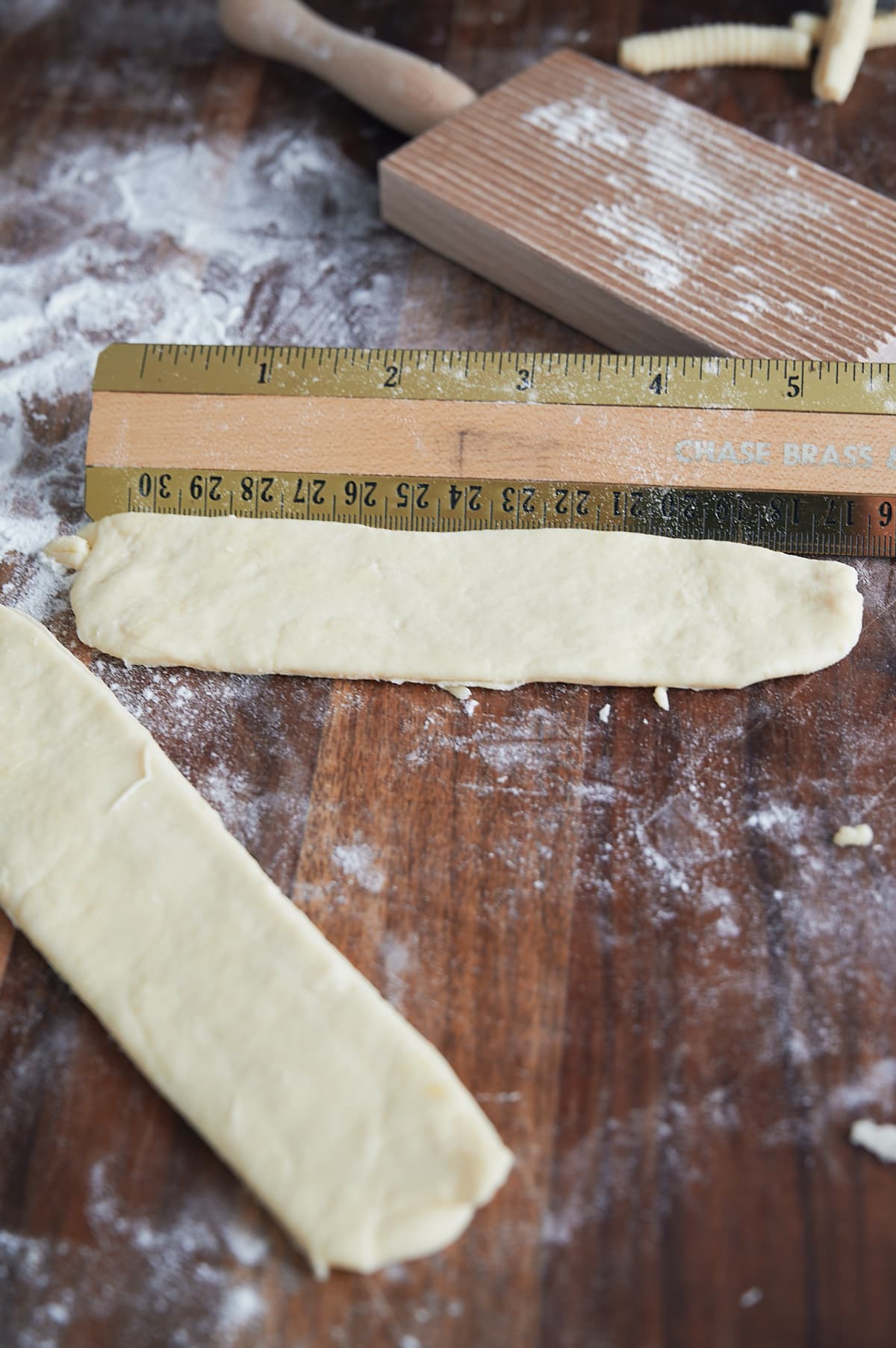 cavatelli pasta dough being measured for pasta machine