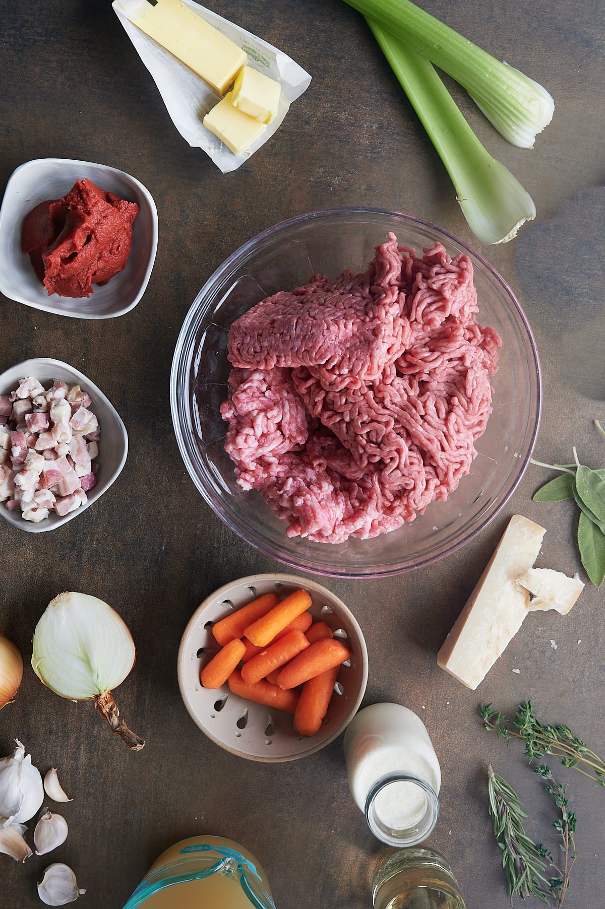Ingredients for tagliatelle bolognese include beef,pork, pancetta, tomatoes, onion, garlic, cream, herbs and wine