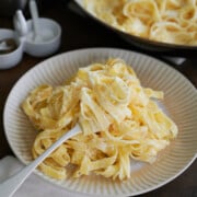 a fork twirling tagliatelle in lemon sauce