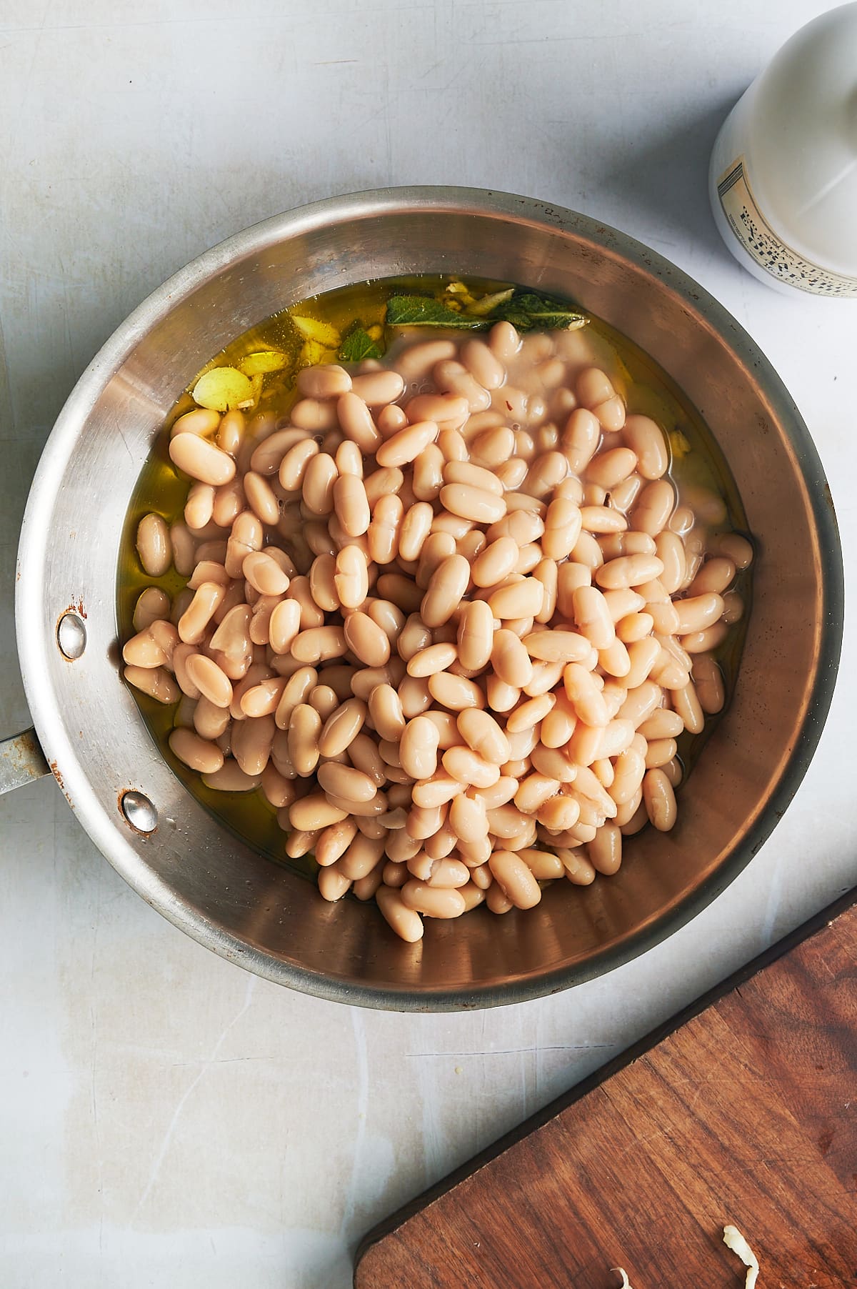 skillet of cannellini beans with olive, sage and garlic.