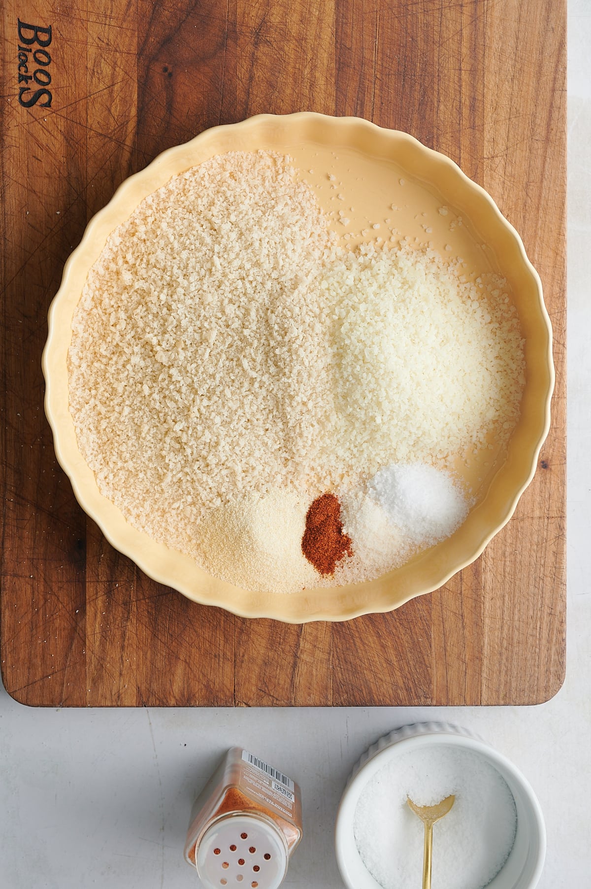 yellow quiche dish with parmesan and panko and seasoning for breading chicken