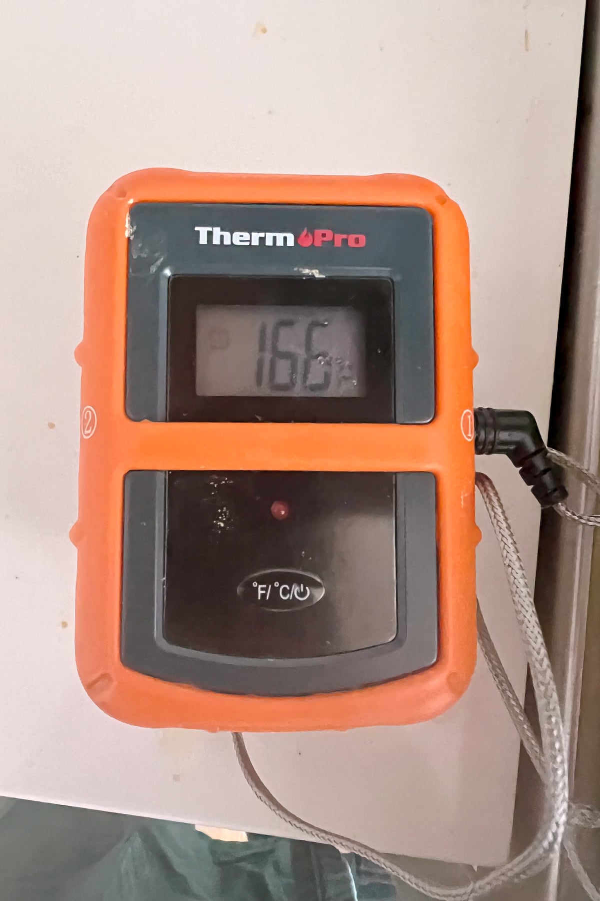 thermometer set at 166 for cooked chicken.