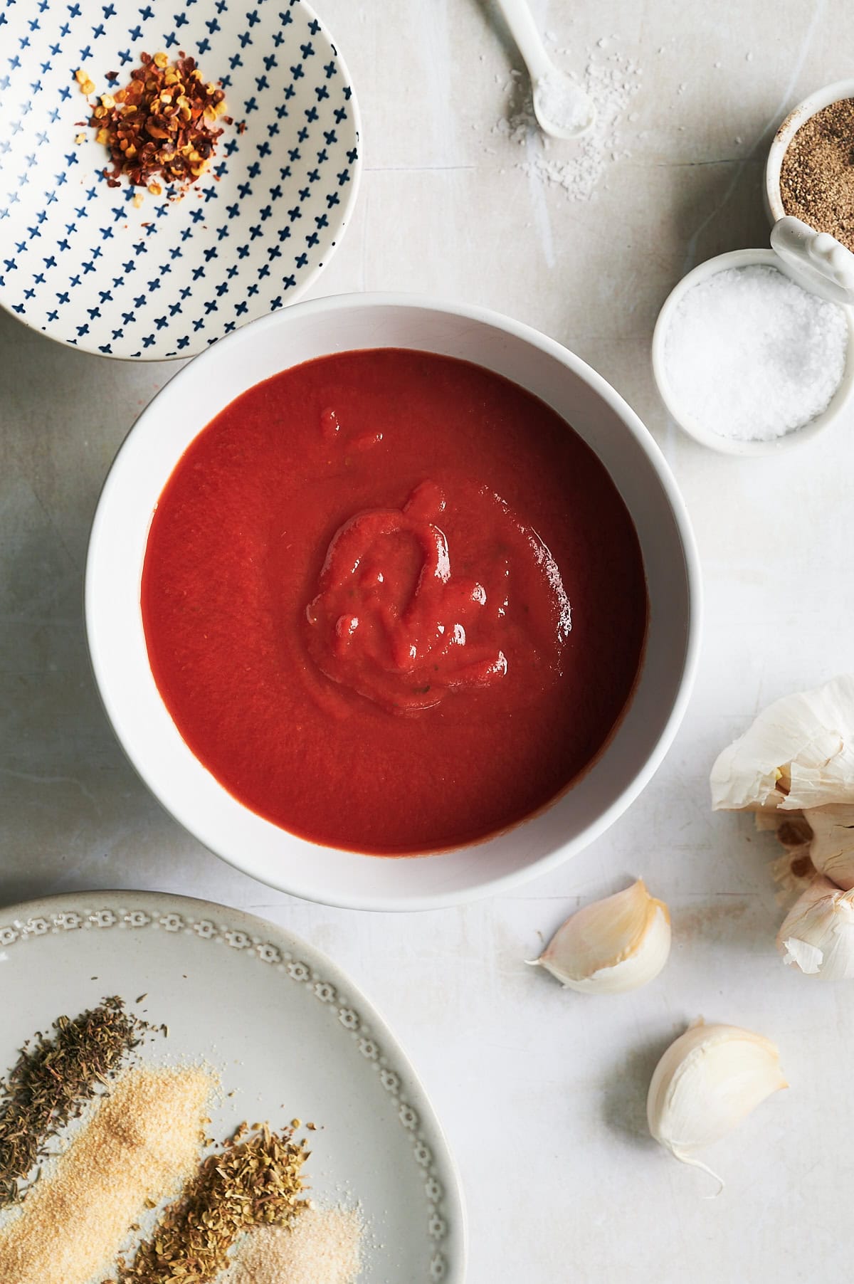 Ingredients for marinara dipping sauce in bowls