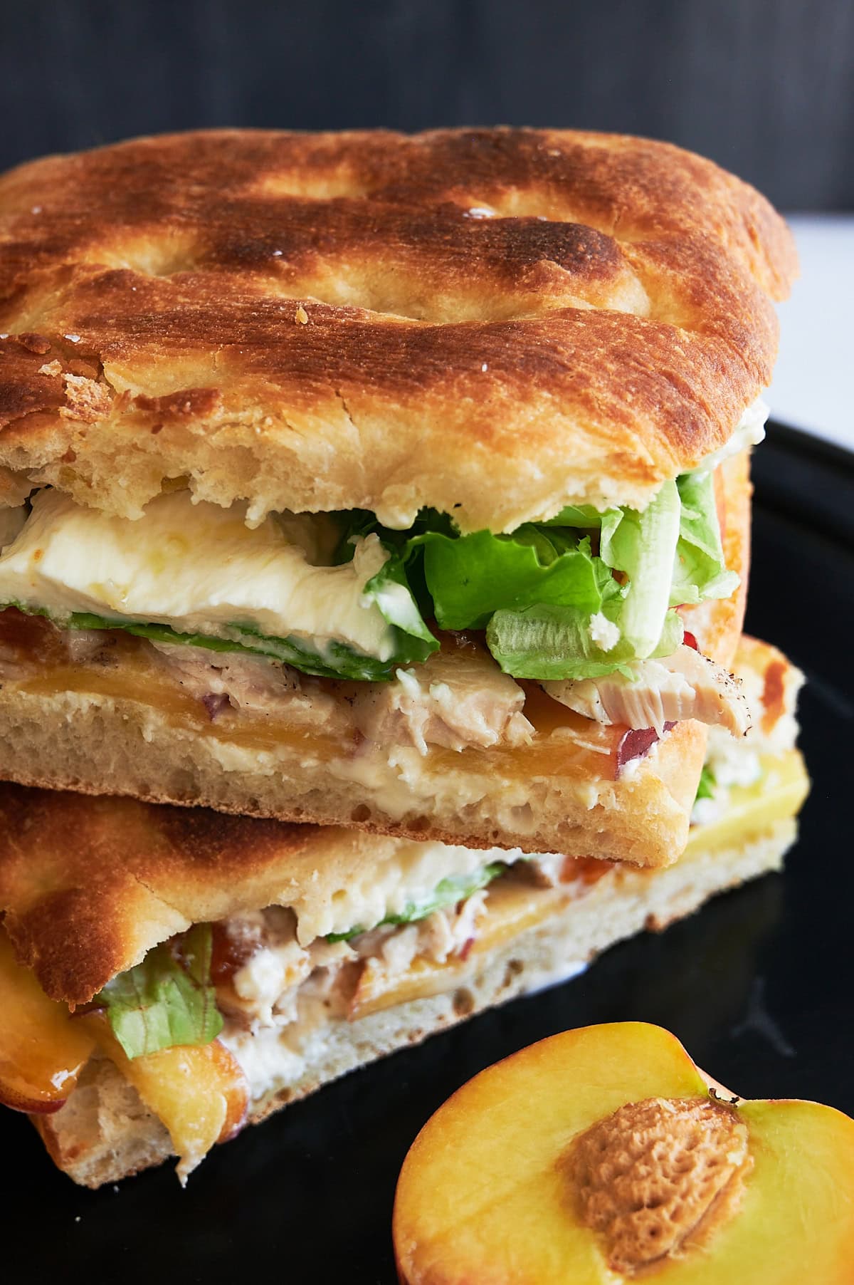 Angled stacked burrata chicken sandwiches.