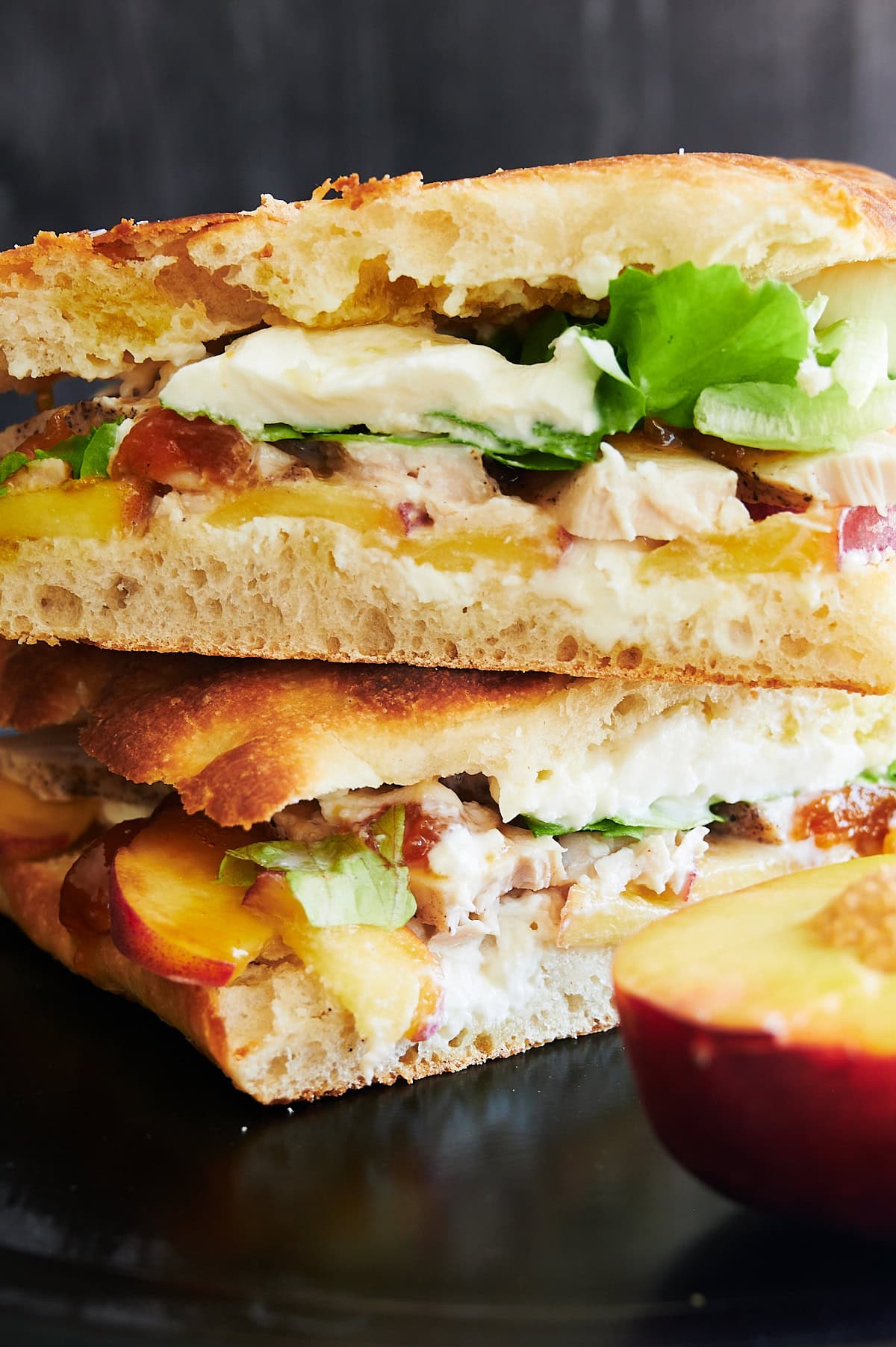 Closeup of burrata chicken sandwiches with peach.