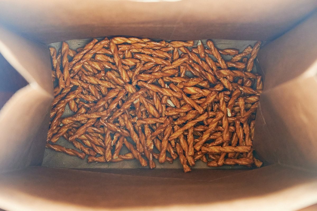 brown bag with butter braid pretzels at the bottom of it.