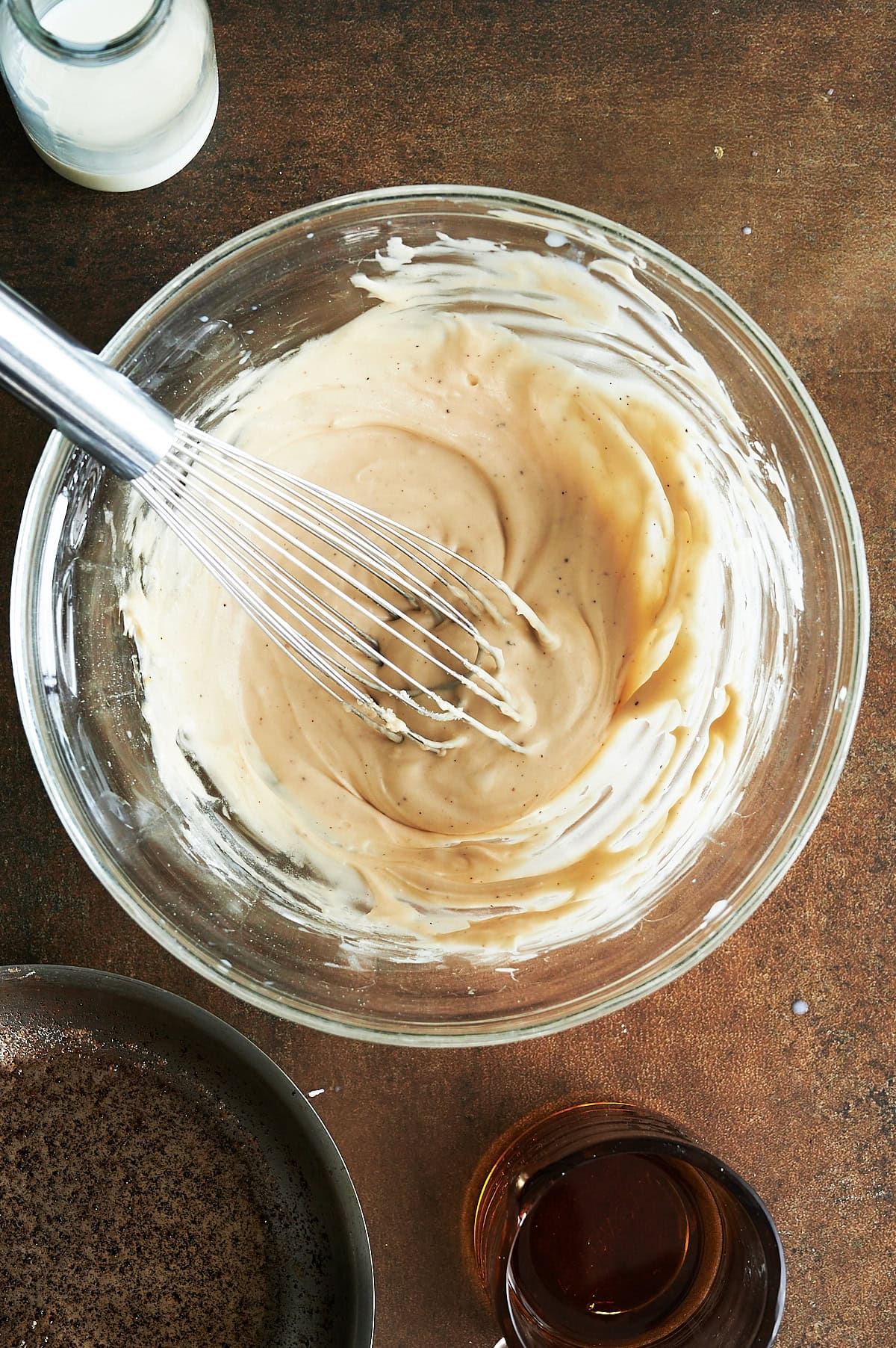Mixed brown butter glaze in a glass bowl.