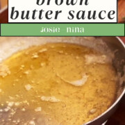 Pinterest image and Close-up of a metal pan containing brown butter pasta sauce with visible browned bits.
