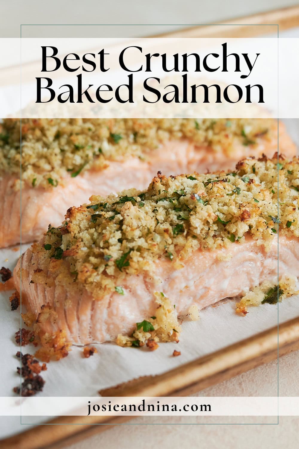 Close-up of baked salmon fillets topped with a golden, crunchy breadcrumb and herb mixture on a baking sheet. Text overlay reads Best Crunchy Baked Salmon.